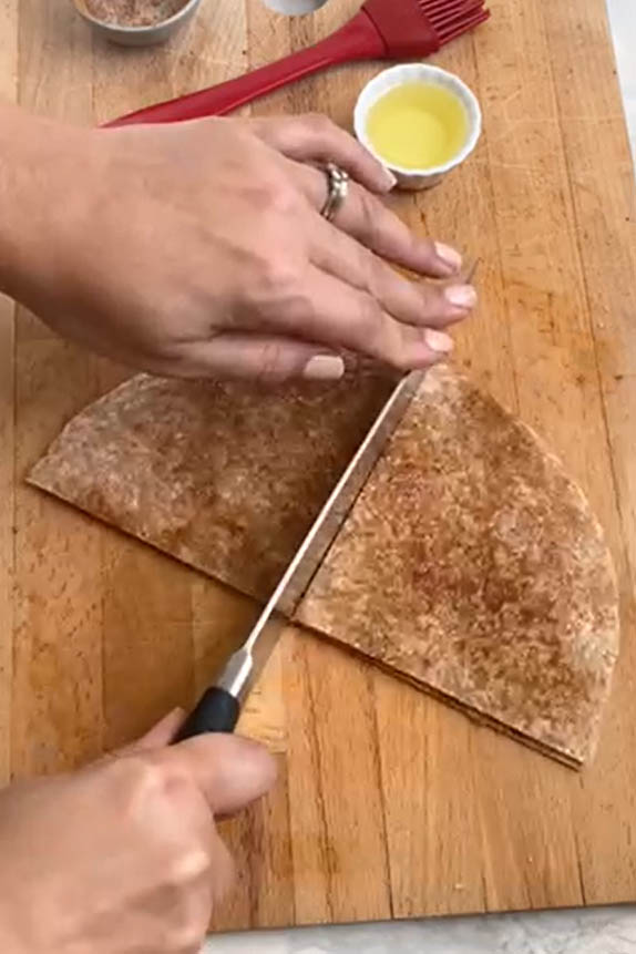 Cut a flour tortilla in quarters.