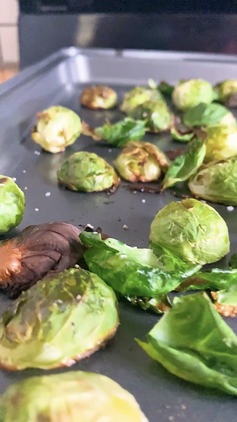 Roasted Brussels sprouts on a baking sheet.