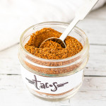 Taco seasoning in a glass jar.