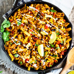 Pasta dish in a cast iron skillet.