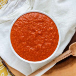 Red enchilada sauce in a bowl.