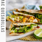 Quesadilla with cheese and lettuce on a white marble board with text title for Pinterest.