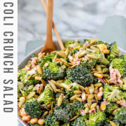 A bowl of broccoli, pepitas, and red onion coated in dressing with text for Pinterest.