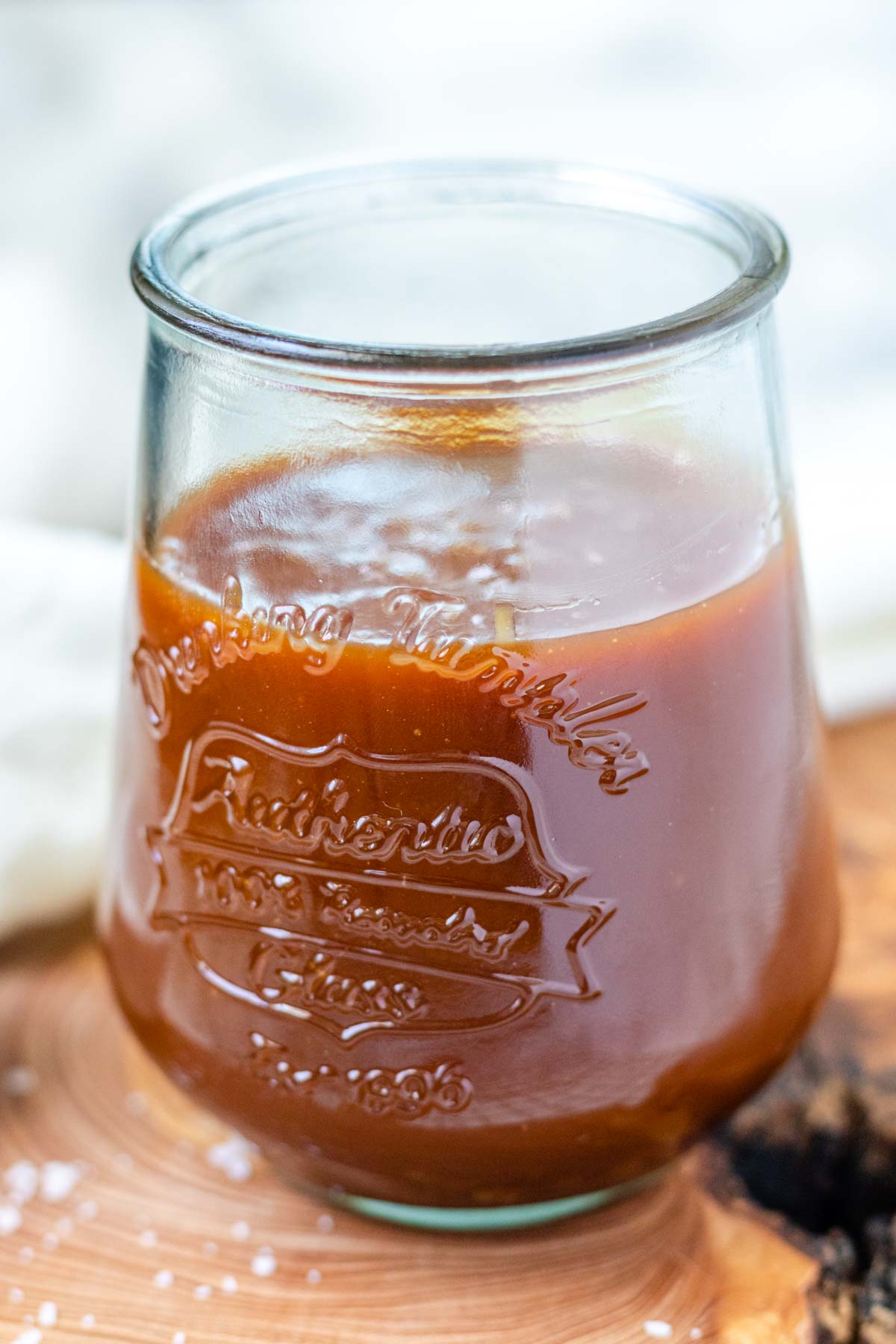 Caramel sauce in a glass.