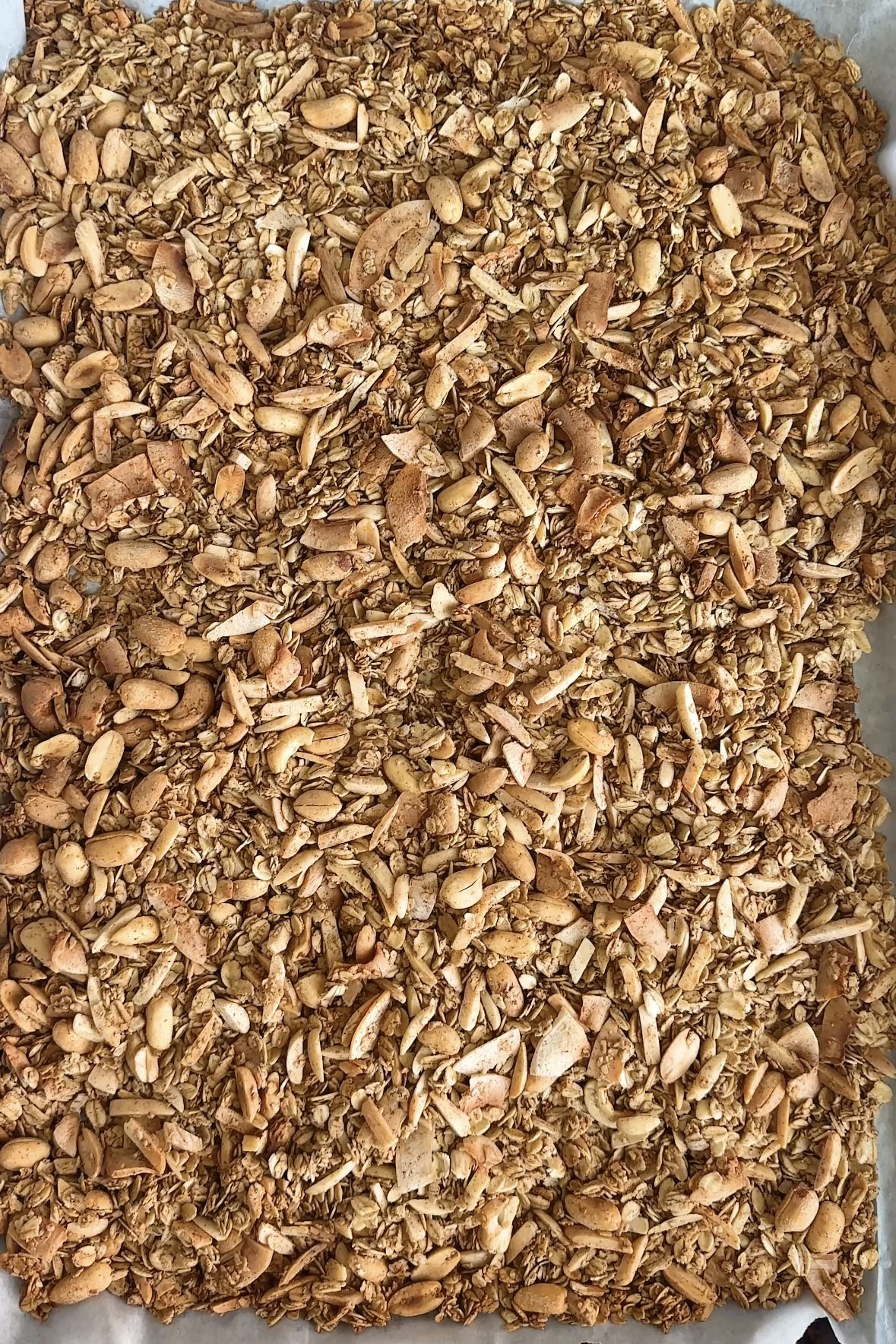 Baked granola on a baking sheet.