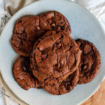 A plate of chocolate chocolate chip cookies.