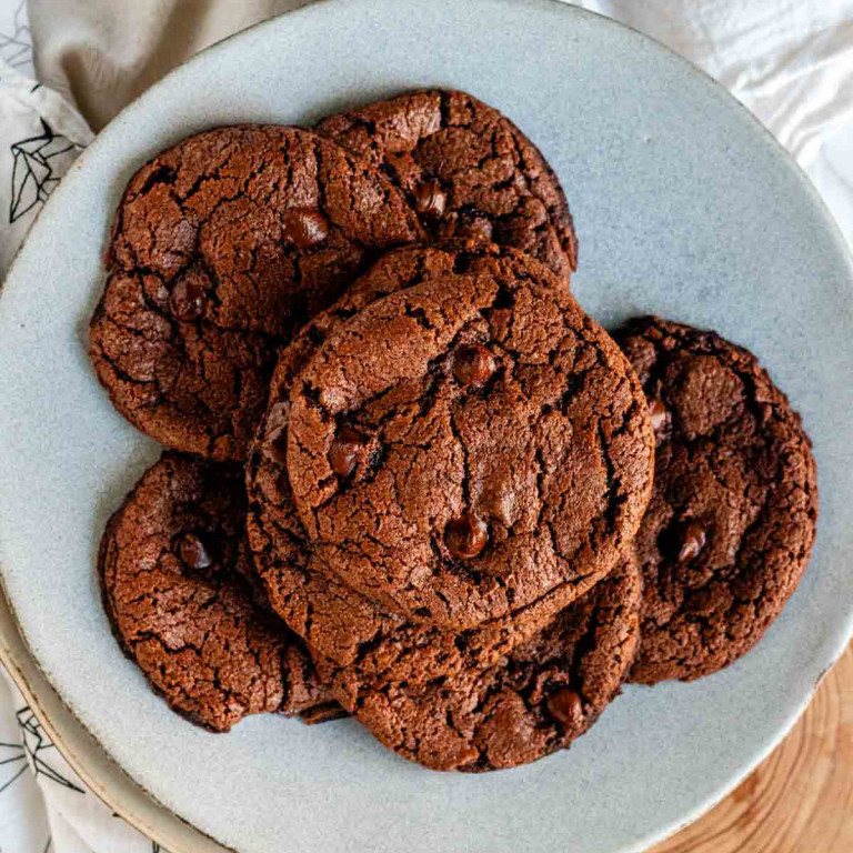 A plate of chocolate chocolate chip cookies.