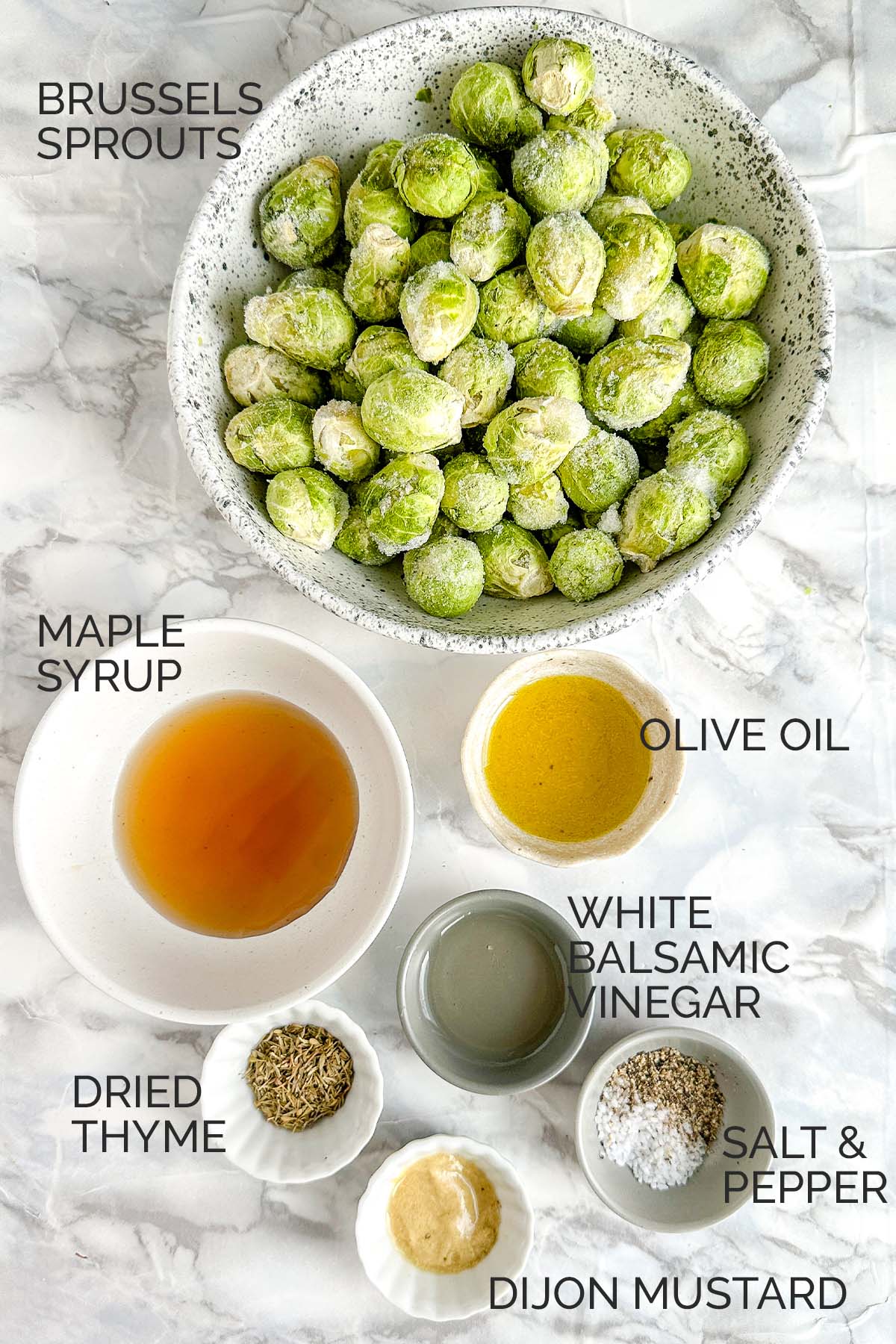 Ingredients in bowls for air fryer Brussels sprouts.