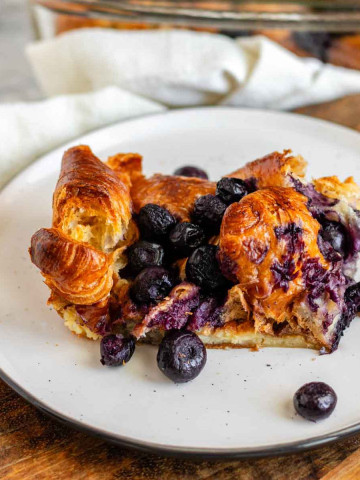 Baked blueberry French toast on a plate.
