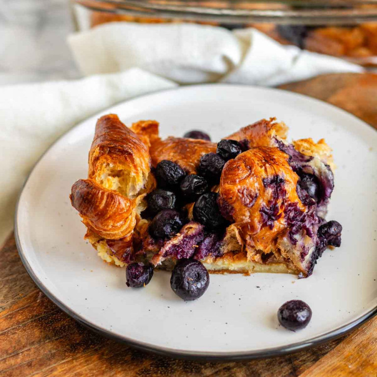 Baked blueberry French toast on a plate.