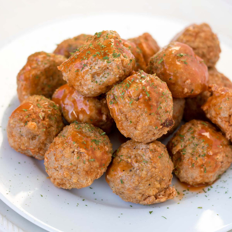 Buffalo turkey meatballs on a plate.