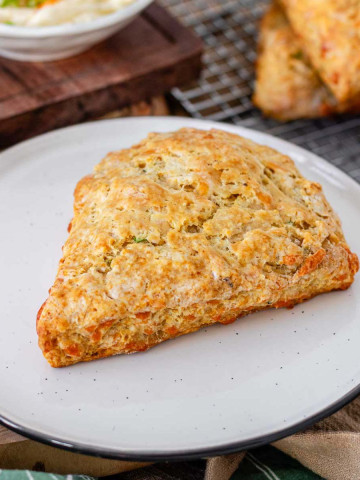 A cheese scones on a plate.