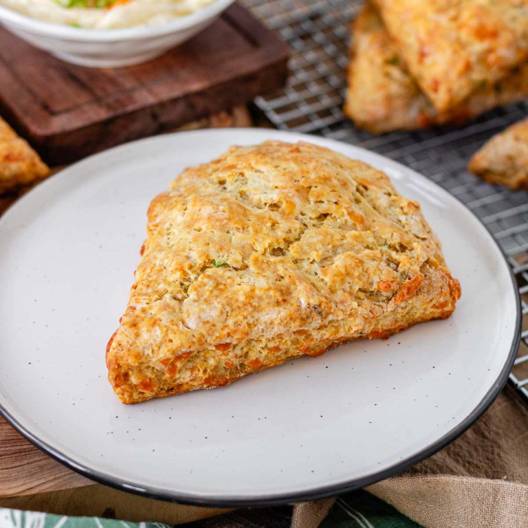 A cheese scones on a plate.