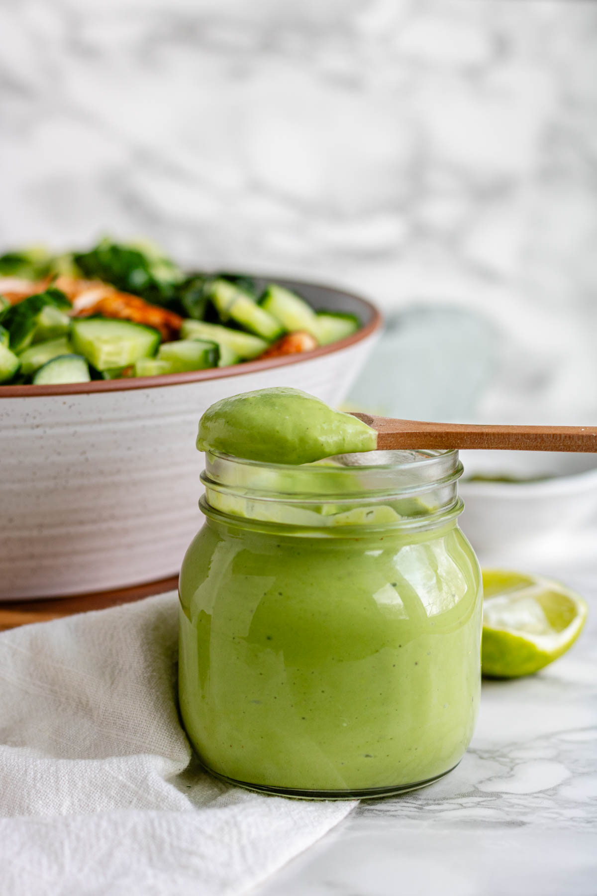 Green salad dressing in a jar.