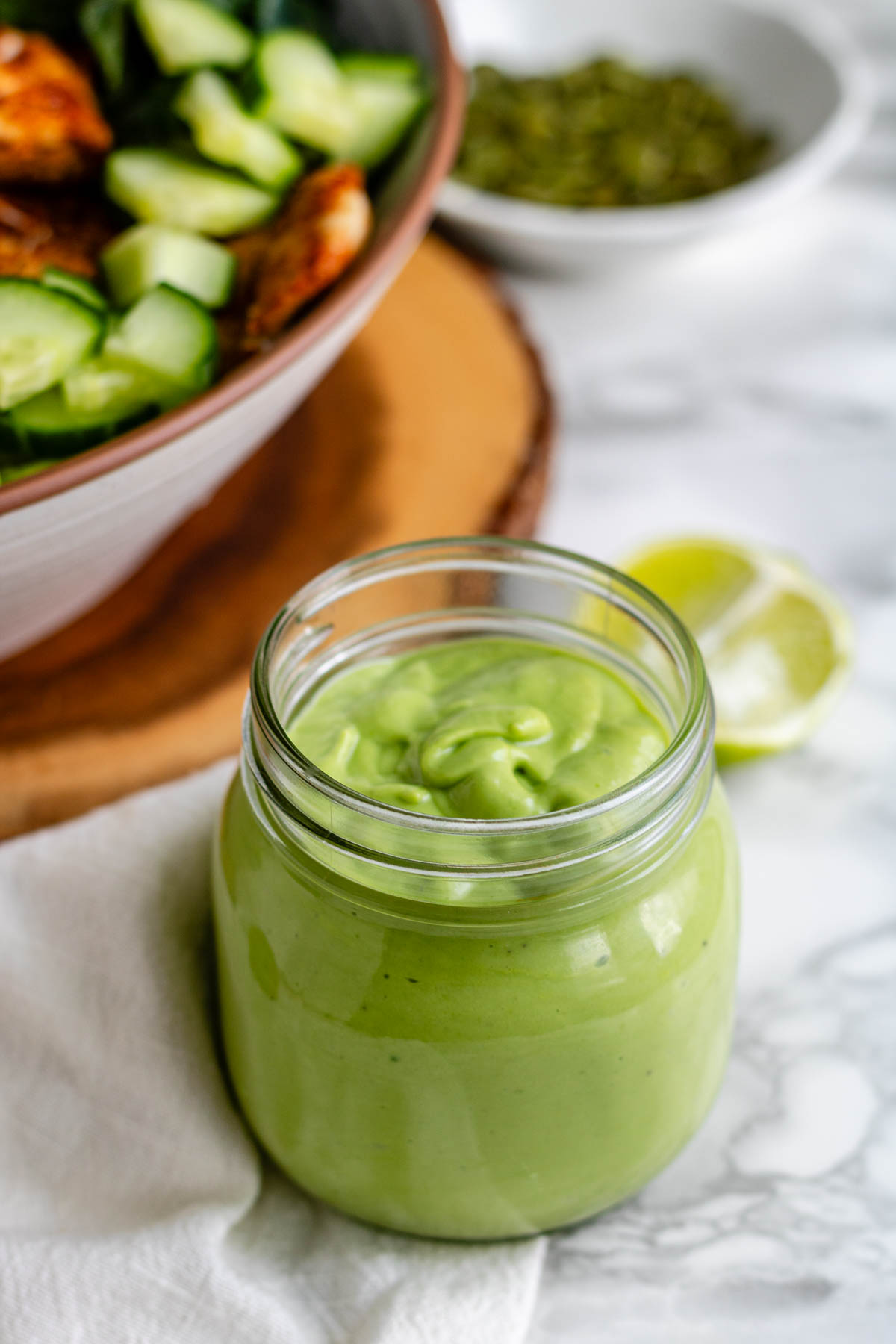 Green salad dressing in a jar.