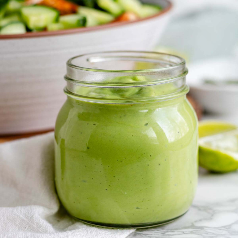 Green salad dressing in a jar.