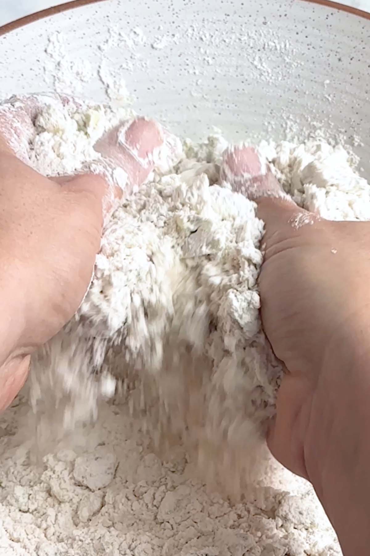 Flour and avocado is combined by hand.