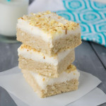 A stack of three coconut sugar cookie bar squares.