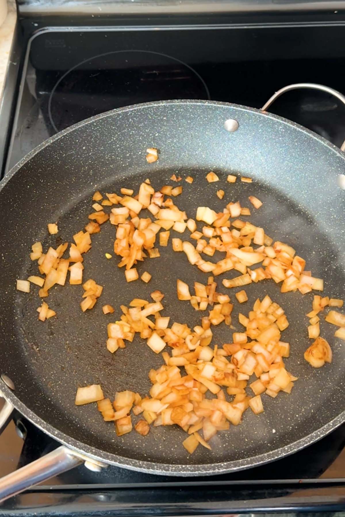 Fried onions in a skillet.