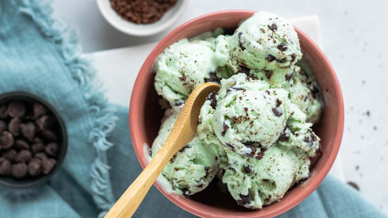 Mint green ice cream with chocolate chips.