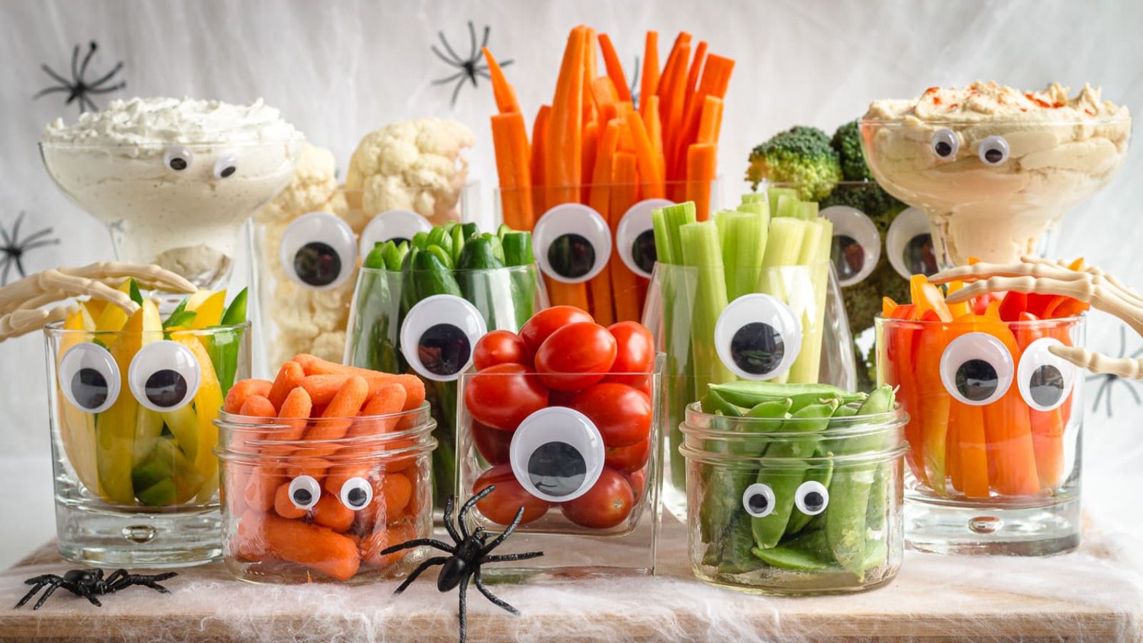 Cut with googly eyes on them filled with vegetables for Halloween.