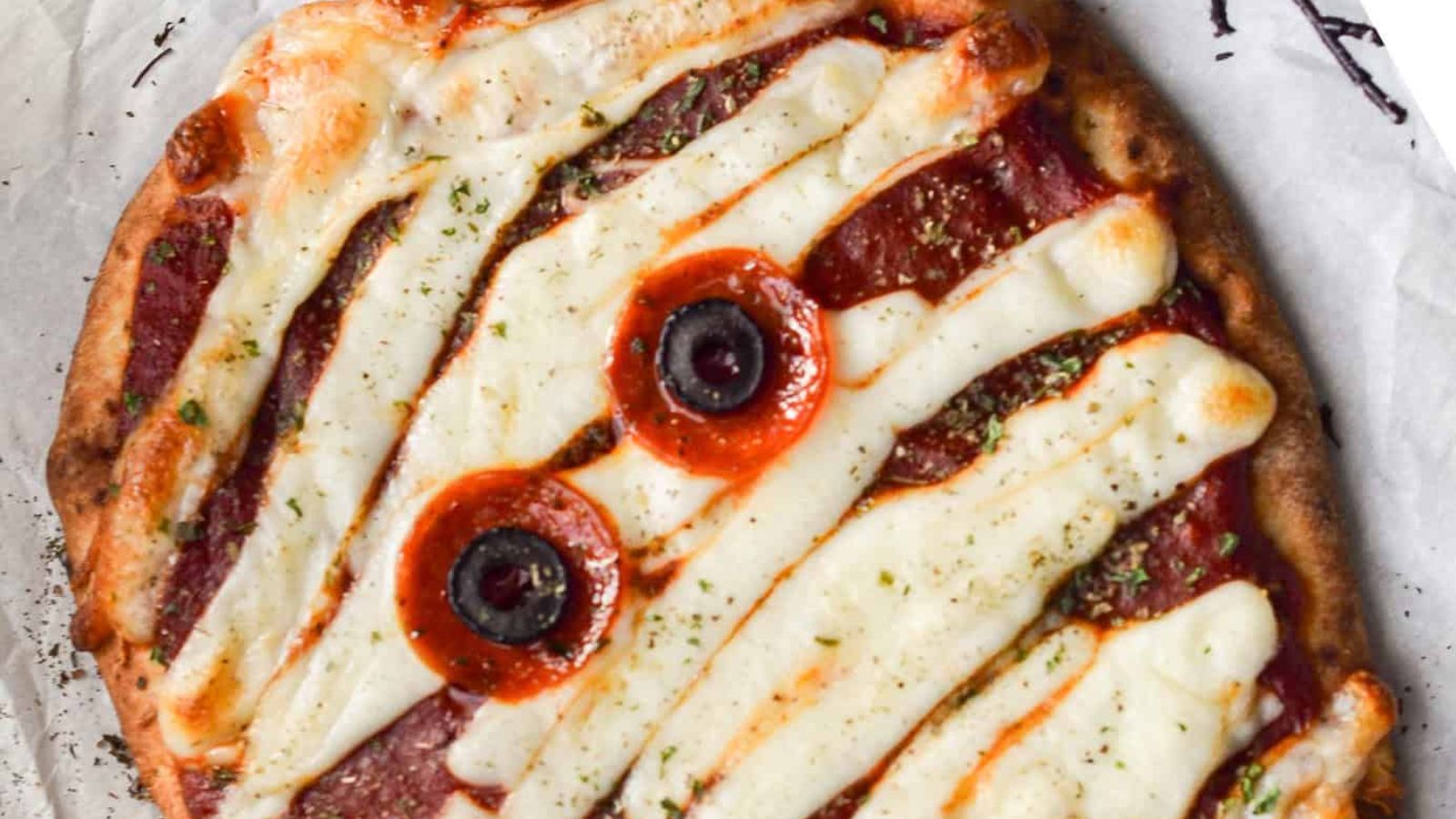 A Pizza made to look like a mummy for Halloween.