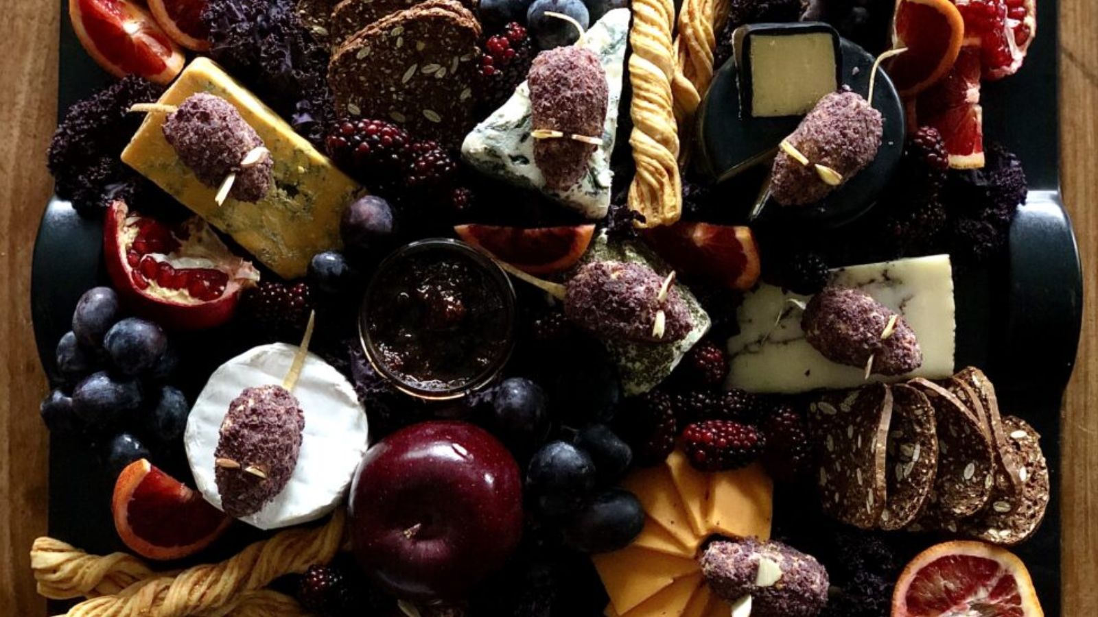 A cheese board with food shaped like mice for Halloween.