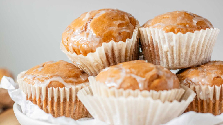 Glazed muffins stacked.