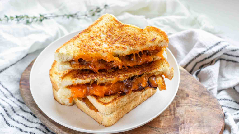 Stacked grilled cheese sandwiches.