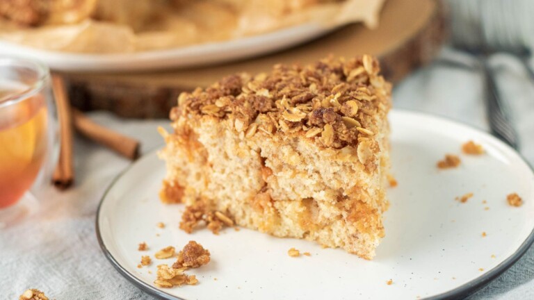 A slice of cinnamon butterscotch cake topped with a streusel topping.