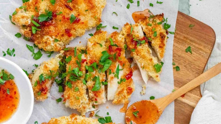 Crispy sliced chicken topped with a hot honey sauce, and chopped herbs.