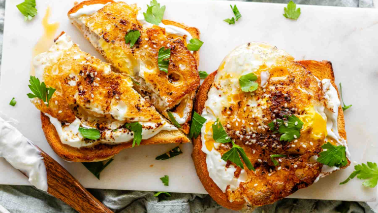 Toast topped with garlic yogurt, fried eggs, and spiced butter.