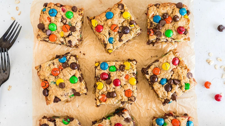Cookie bar squares with m & m sliced in squares.