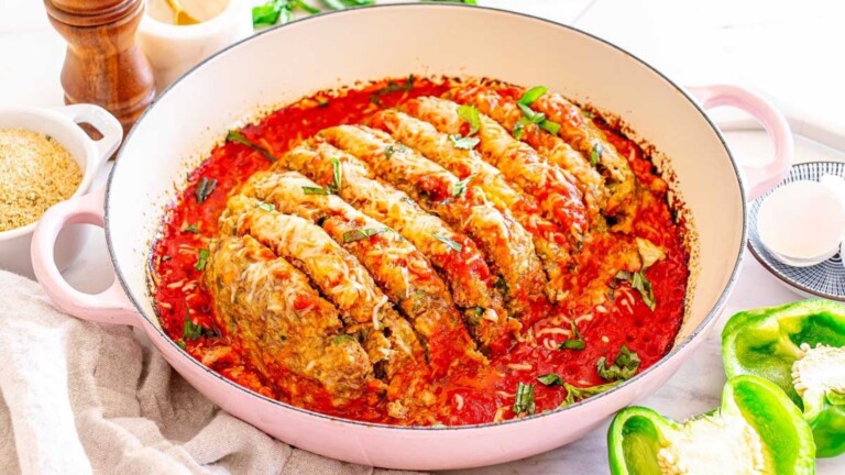 A sliced meatloaf in a skillet.
