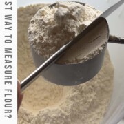 A knife leveling flour in a measuring cup with the text the best way to measure flour?