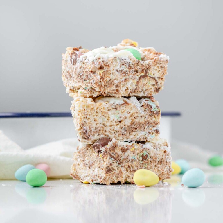 Stacked rice krispies squares with mini eggs.