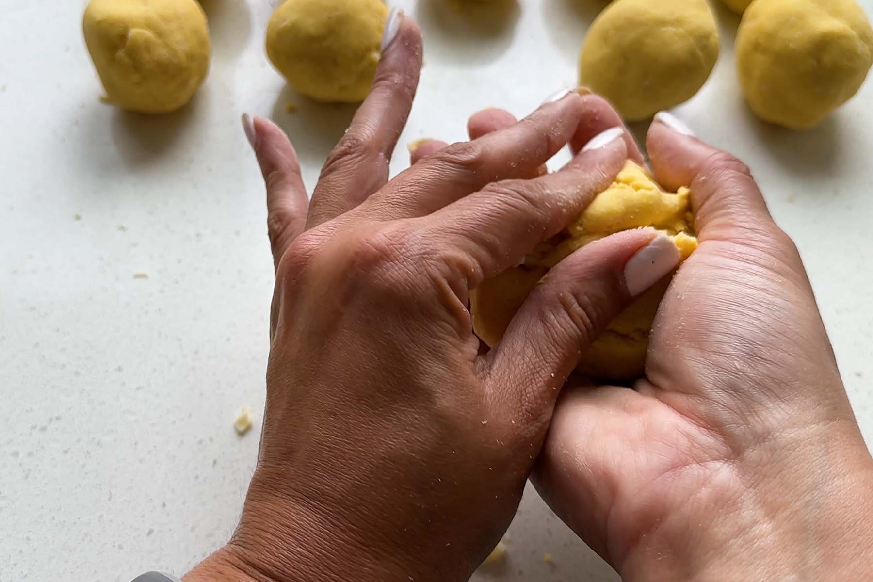 Corn dough is molded by hand.