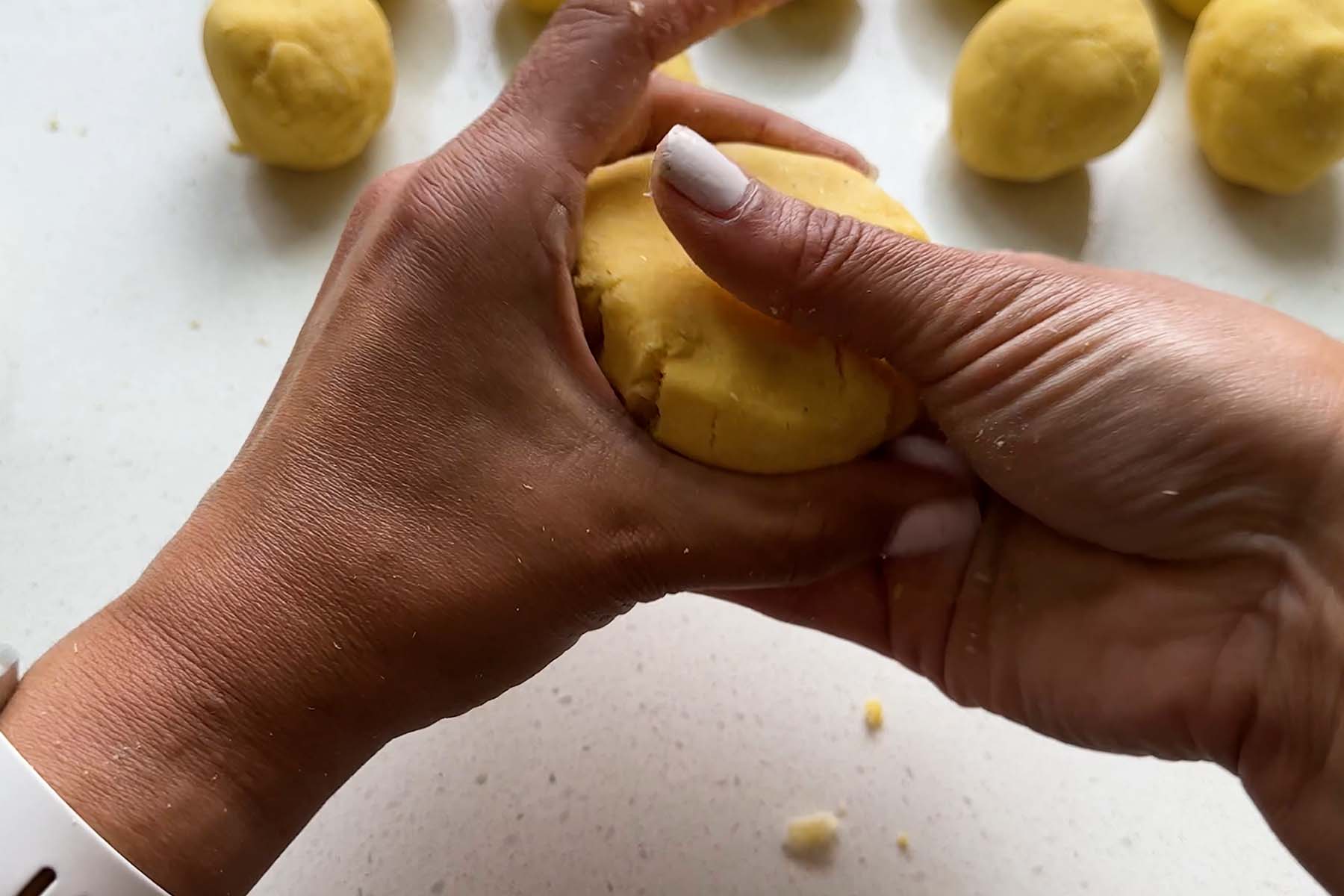 Corn dough is molded by hand.