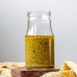 Green salad dressing in a jar.