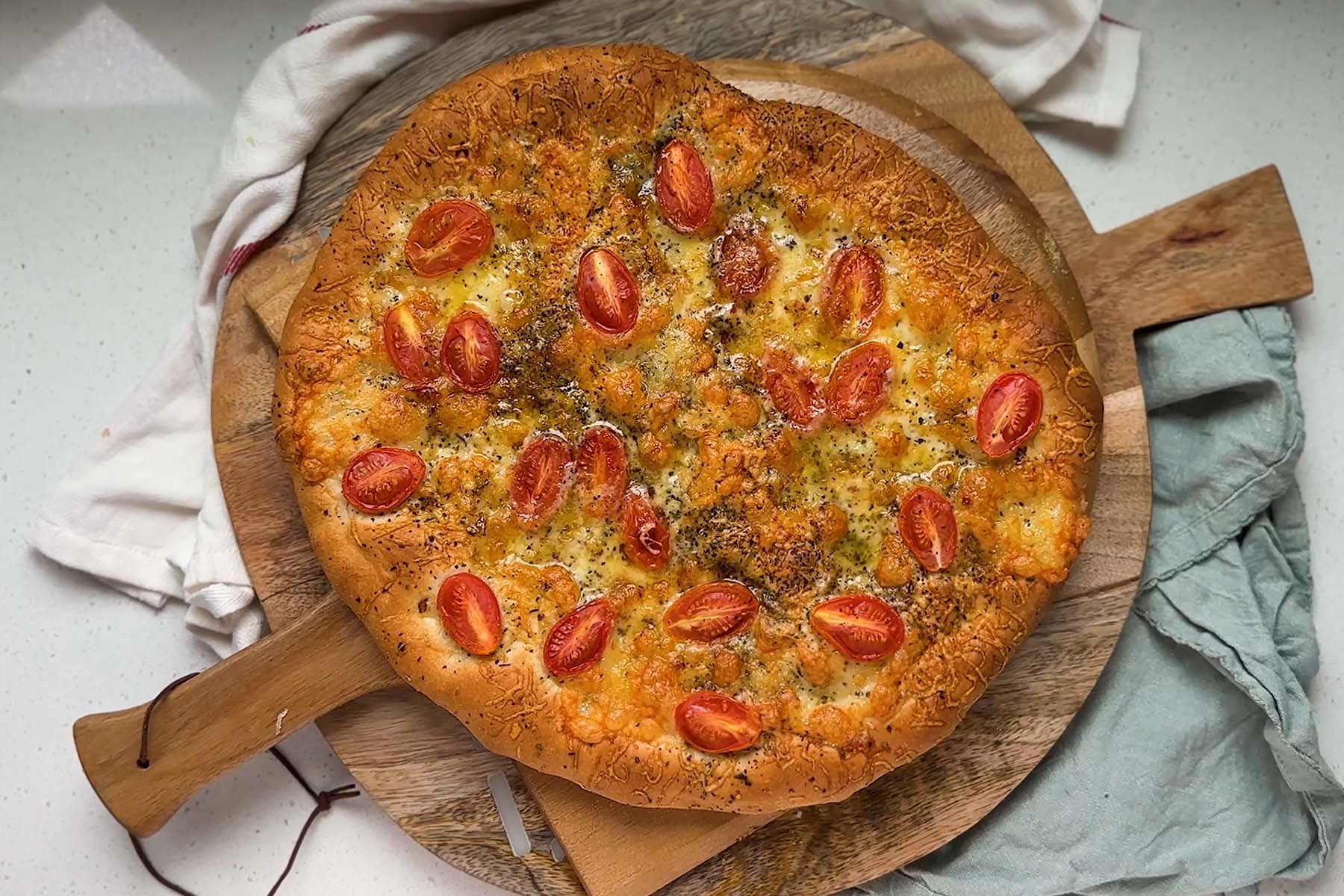 Pizza topped with tomatoes.