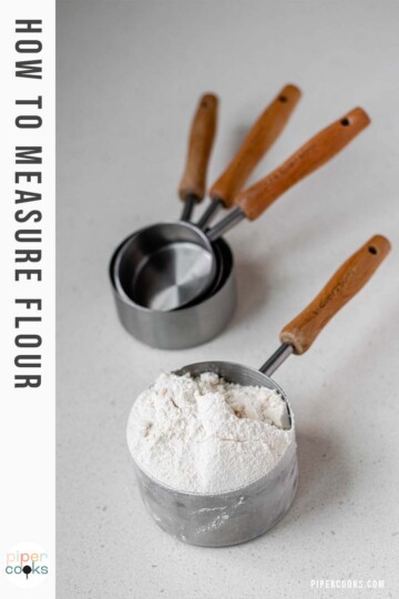 A measuring cup with flour in it with the text how to measure flour.