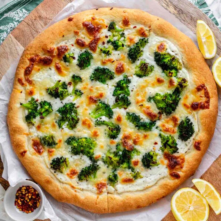 Homemade broccoli cottage cheese pizza topped with fresh mozzarella and lemon zest on a golden baked crust.