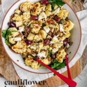 A large serving bowl with roasted cauliflower, black olives, lentils, feta cheese, slivered almonds, and fresh parsley with the text cauliflower lentil salad.
