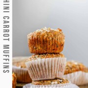 Three muffins stacked with the text zucchini carrot muffins.