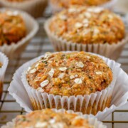 Muffins on a wire rack with the text zucchini carrot muffins.