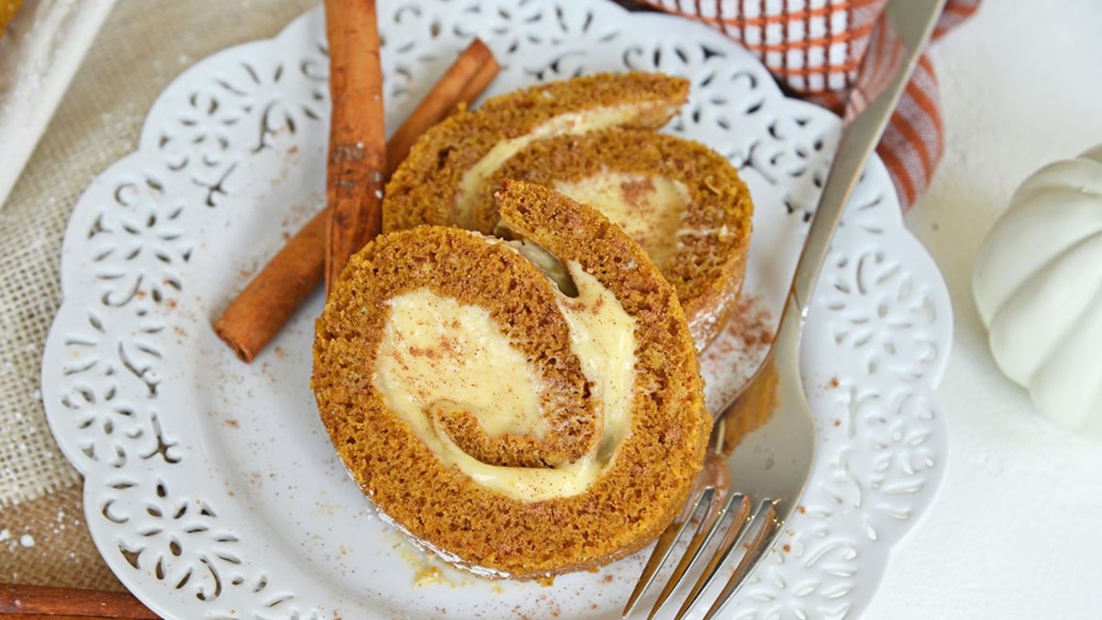Slices of a spiral cake with an icing filling.