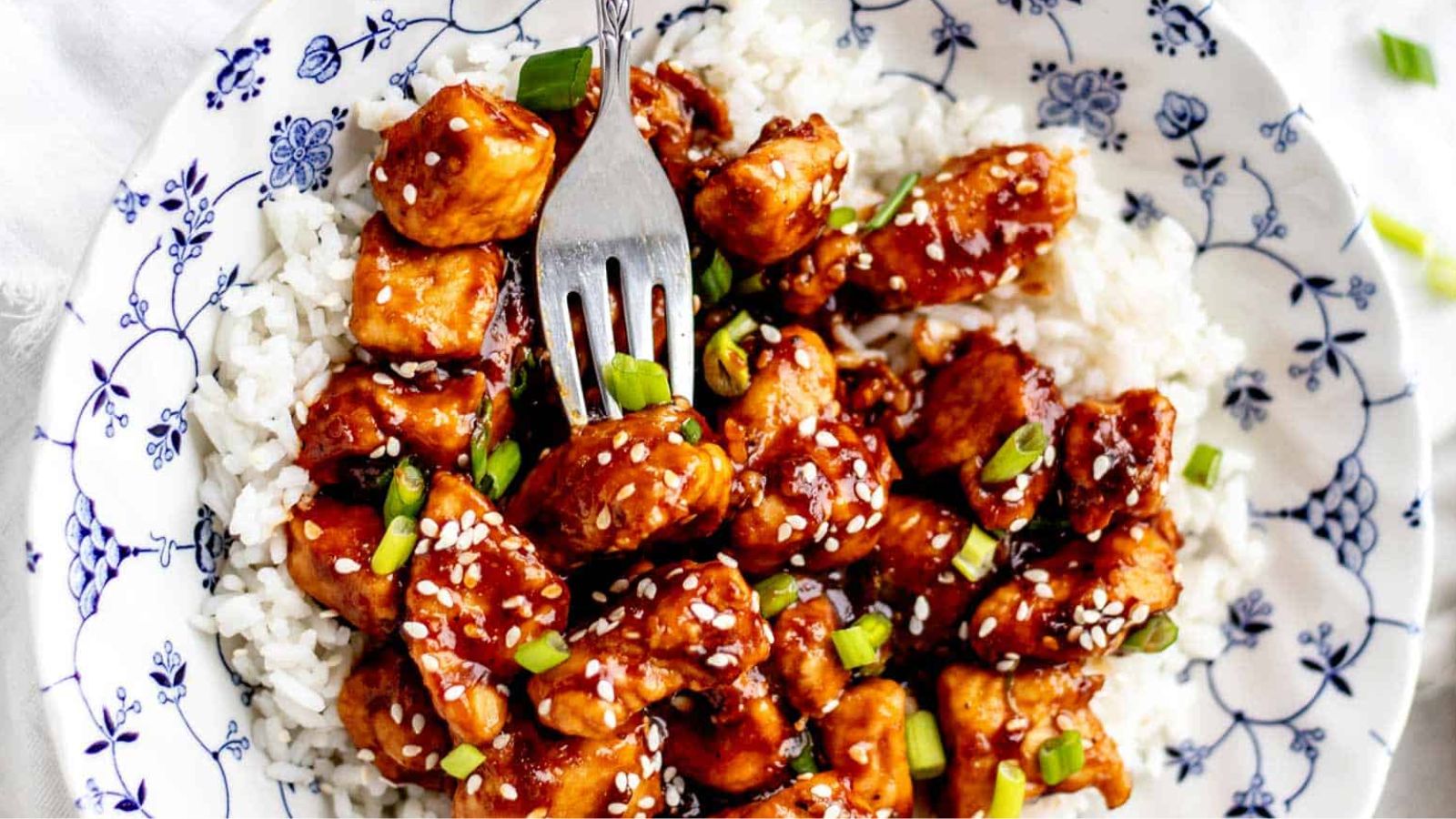 Chicken and rice on a plate.
