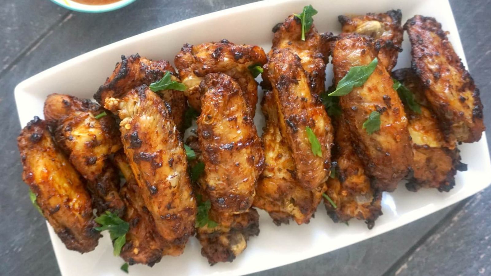 Chicken wings on a platter.