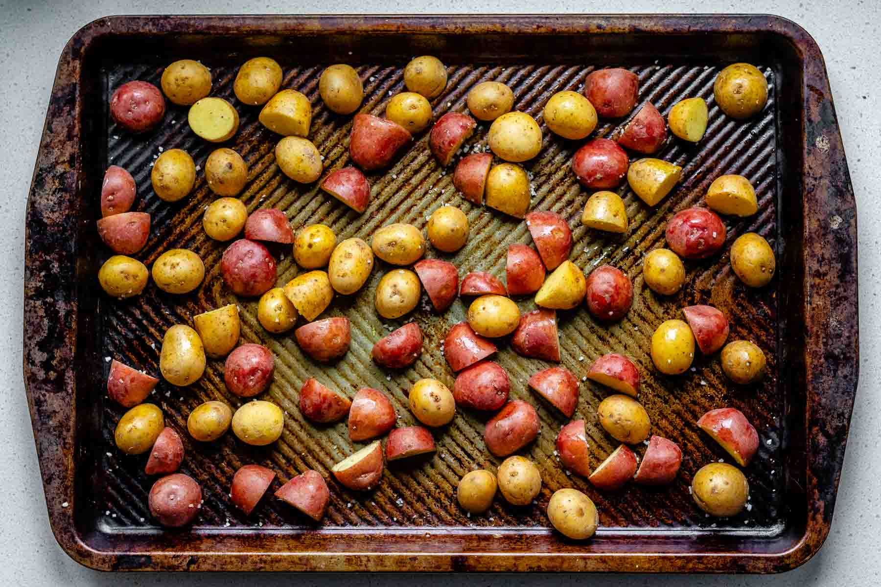 Sheet pan with baby potatoes.
