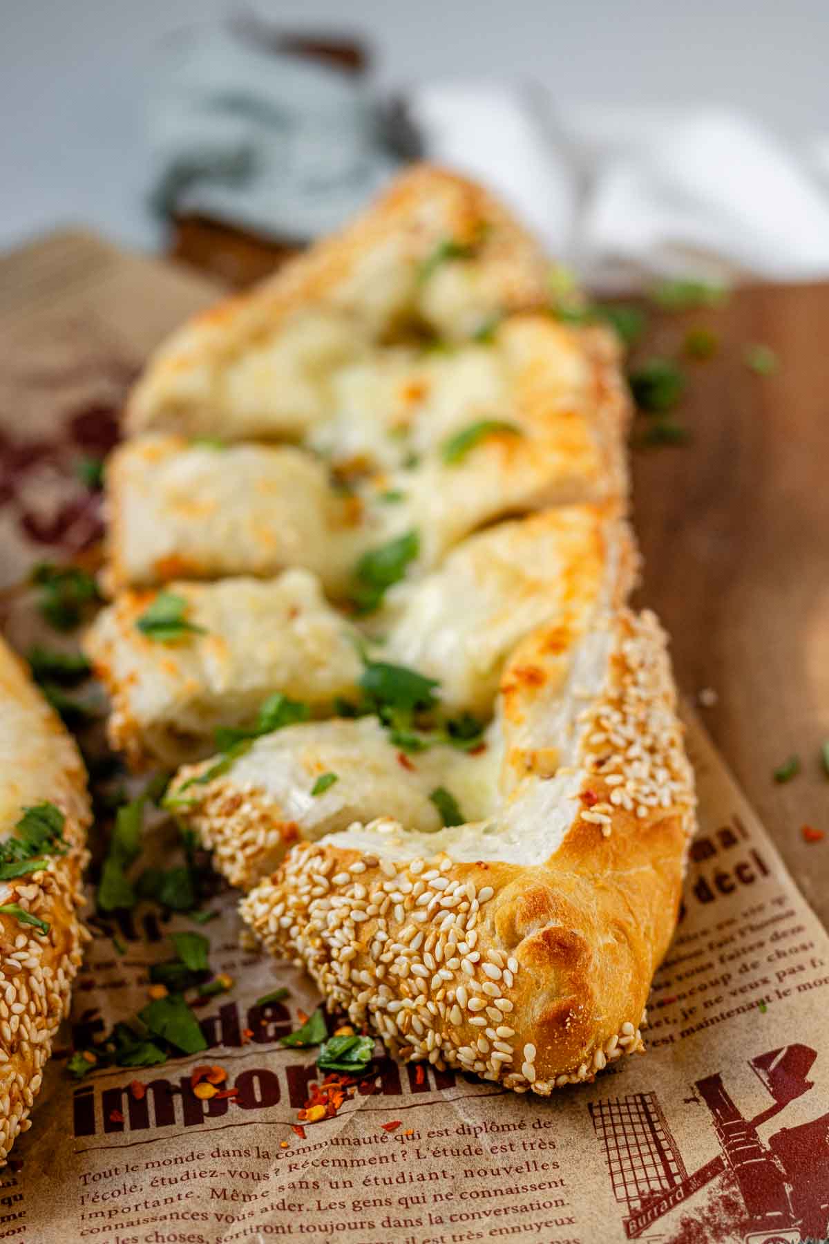 Boat-shaped baked dough filled with melted cheese.
